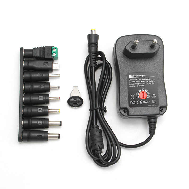 Picture of Multifunctional charger with adjustable 3-12v American standard power adapter comes with (8 heads) compatible with various devices for power supply
